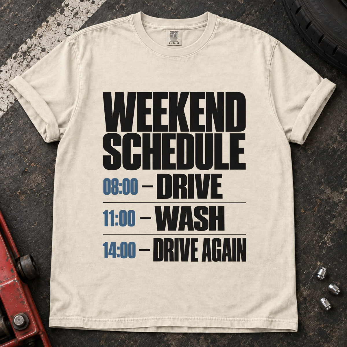 Ivory T-shirt listing a weekend schedule: '08:00 Drive, 11:00 Wash, 14:00 Drive again'.
