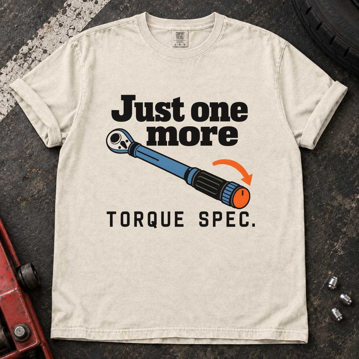 Ivory T-shirt showing a blue torque wrench and orange arrow with 'Just one more torque spec'.