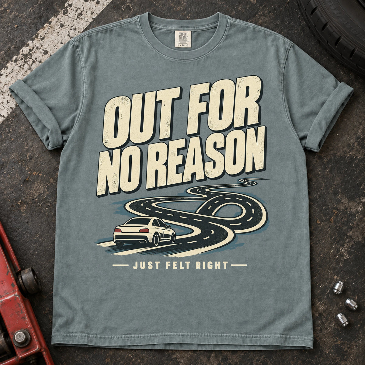 Bay car enthusiast T-shirt. A car follows a winding road, out for no reason because it just felt right.