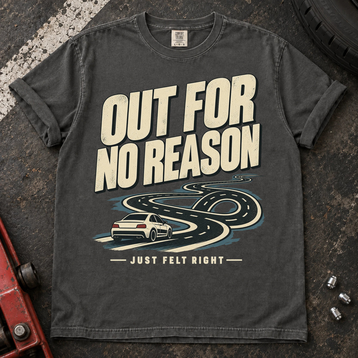Pepper car enthusiast T-shirt. A car follows a winding road, out for no reason because it just felt right.