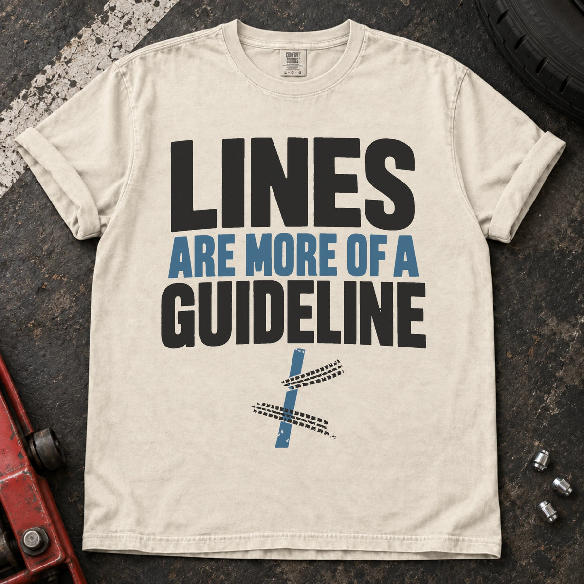 Ivory car enthusiast T-shirt. A road line and tire tracks argue lines are more of a guideline.
