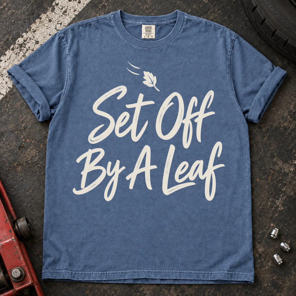 Blue Jean car enthusiast T-shirt. A falling leaf accompanies set off by a leaf.