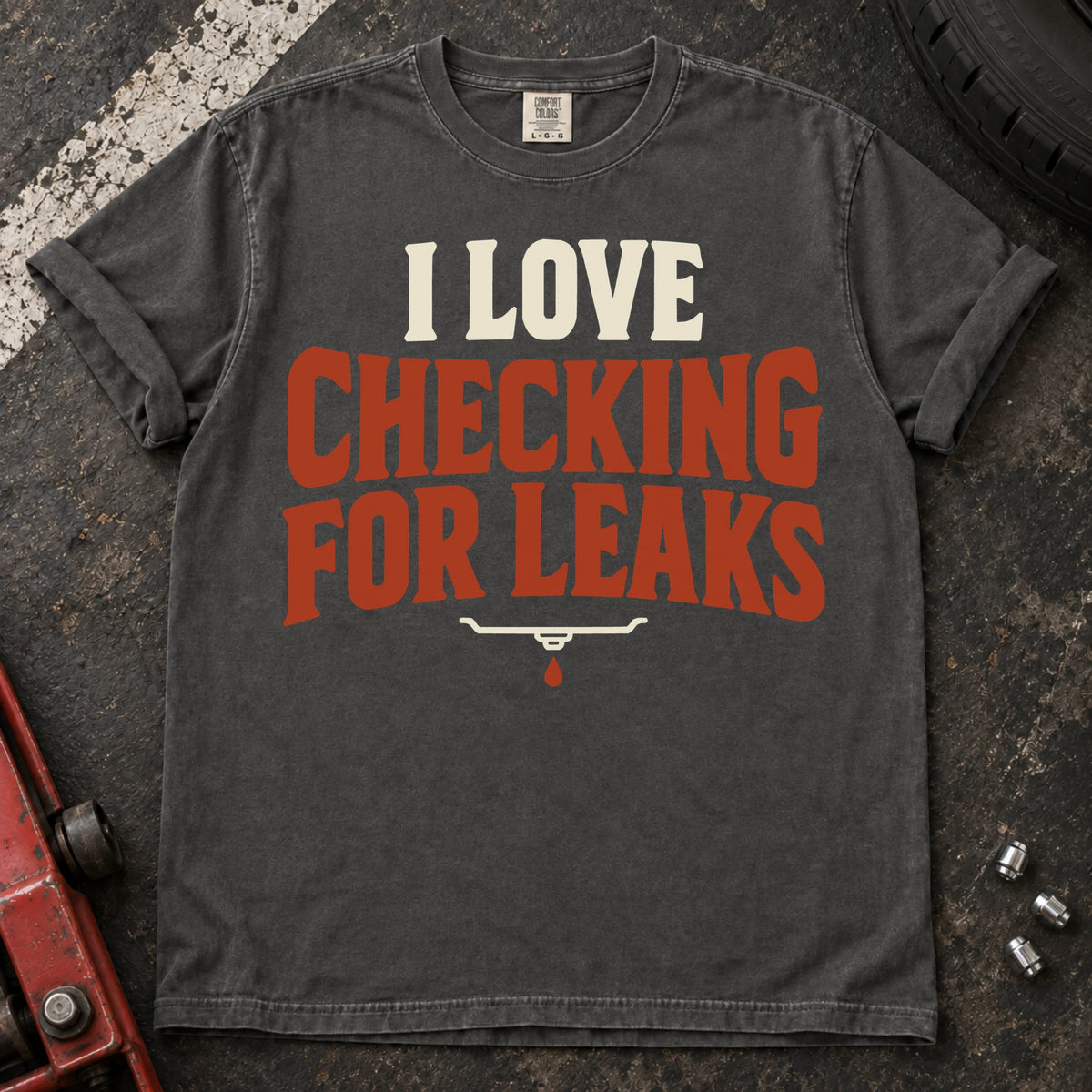 Pepper T-shirt reading 'I love checking for leaks' above a small oil-pan and droplet symbol.