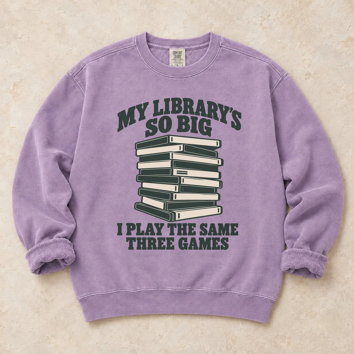 Orchid gaming sweatshirt. A huge library stack admits playing the same three games.