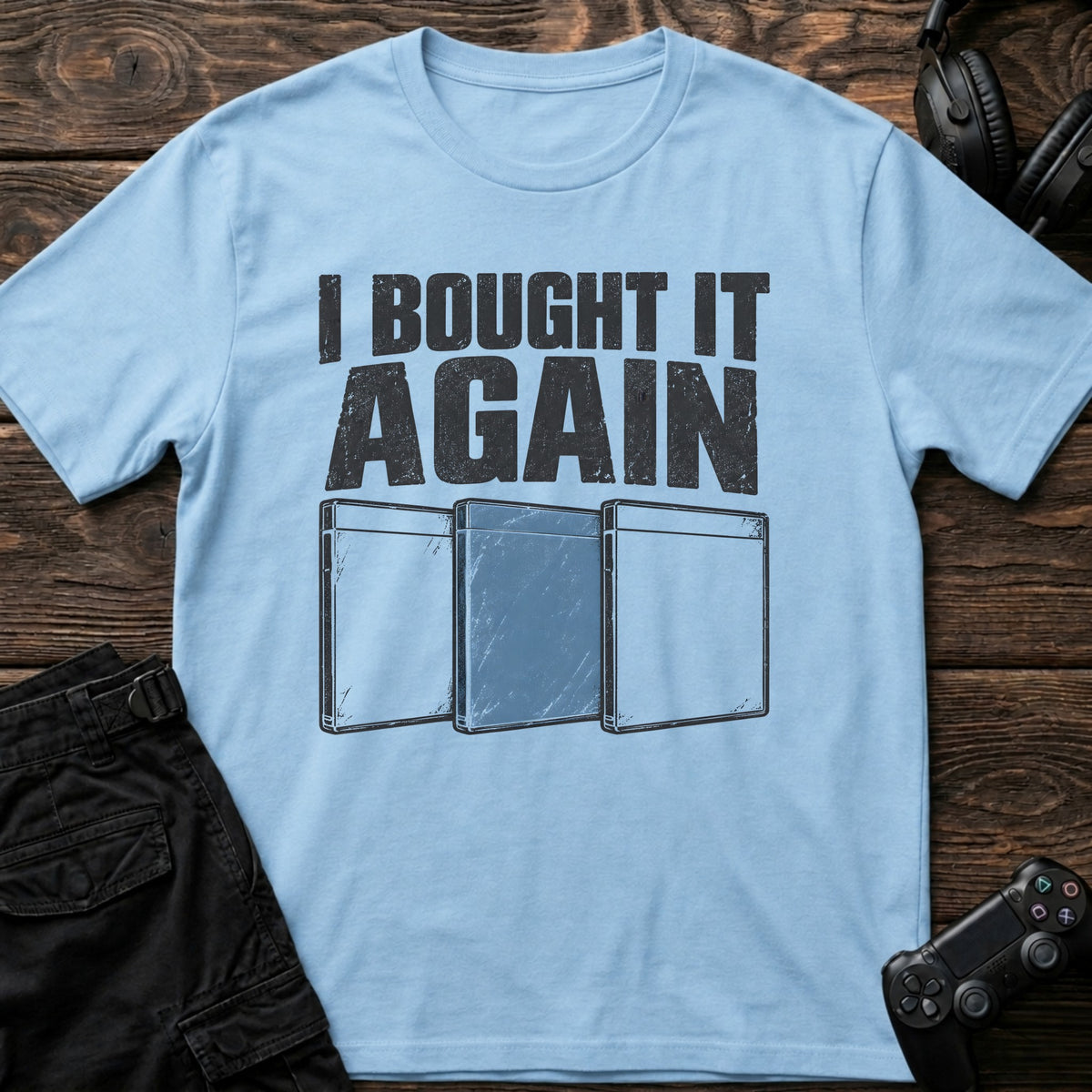 Light Blue gaming T-shirt. Three game cases admit buying it again.