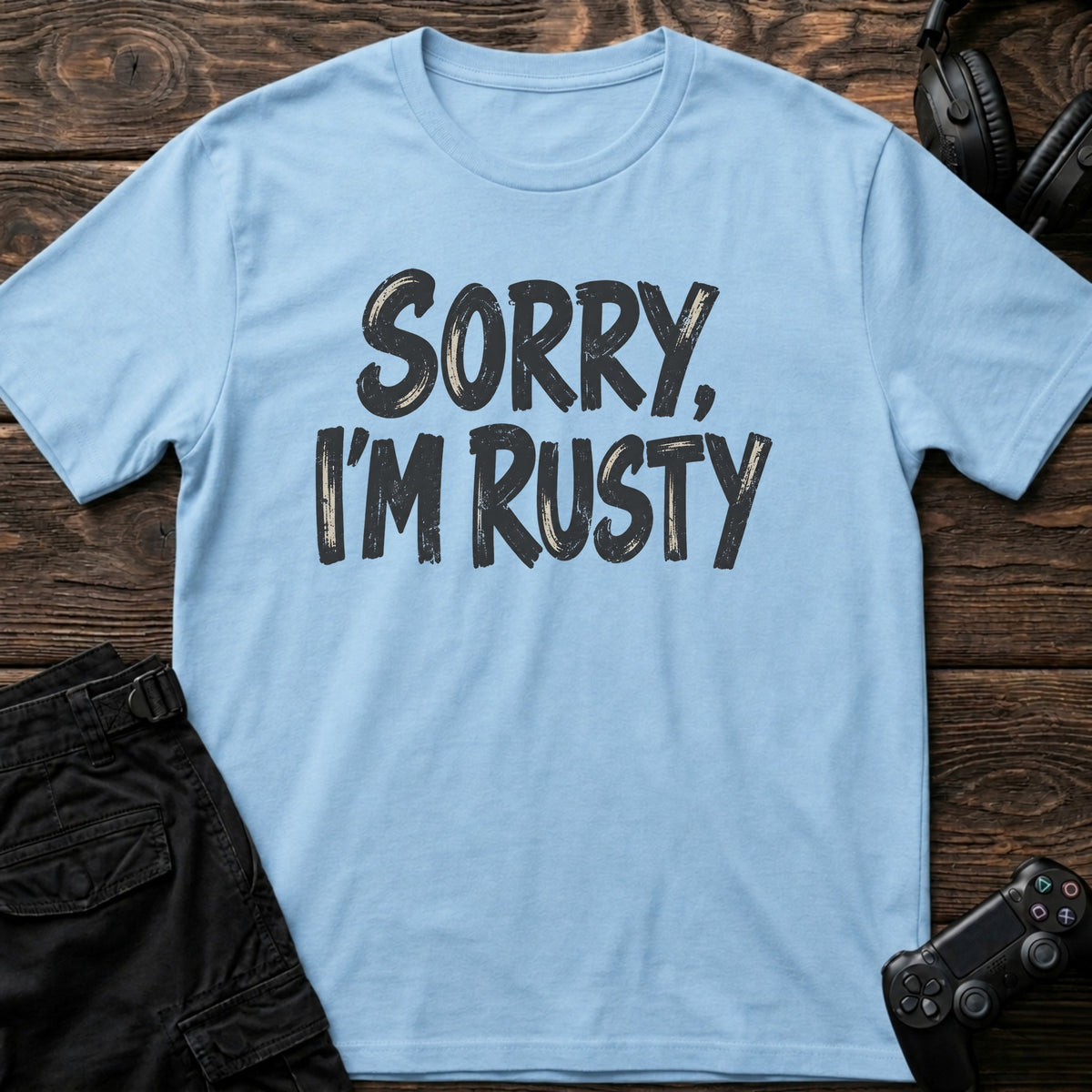Light Blue gaming T-shirt. Sorry, I'm rusty, in bold brush-style gamer lettering.