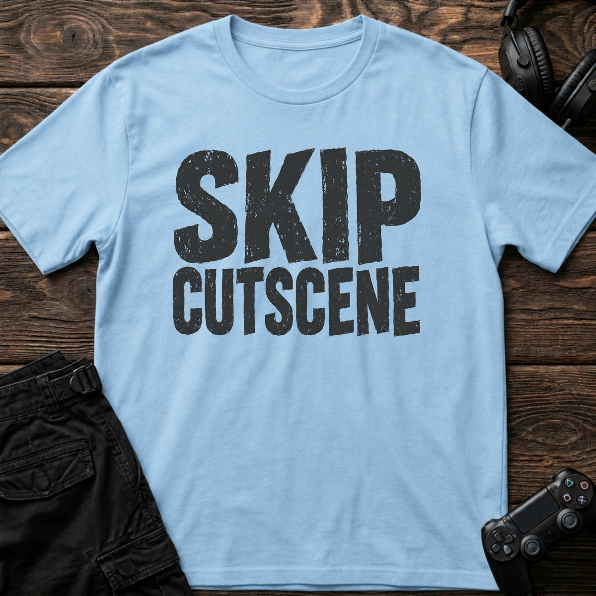 Light Blue gaming T-shirt. Skip cutscene, in worn bold lettering for impatient gamers.