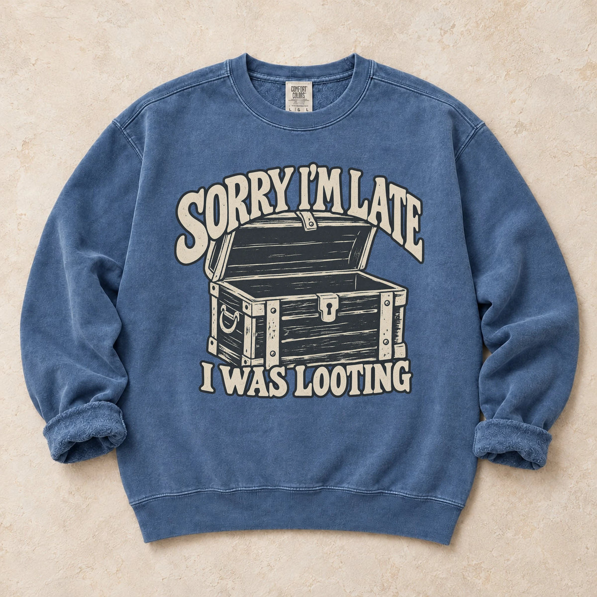 Blue Jean gaming sweatshirt. A treasure chest explains the apology, sorry I'm late, I was looting.