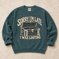 Blue Spruce gaming sweatshirt. A treasure chest explains the apology, sorry I'm late, I was looting.