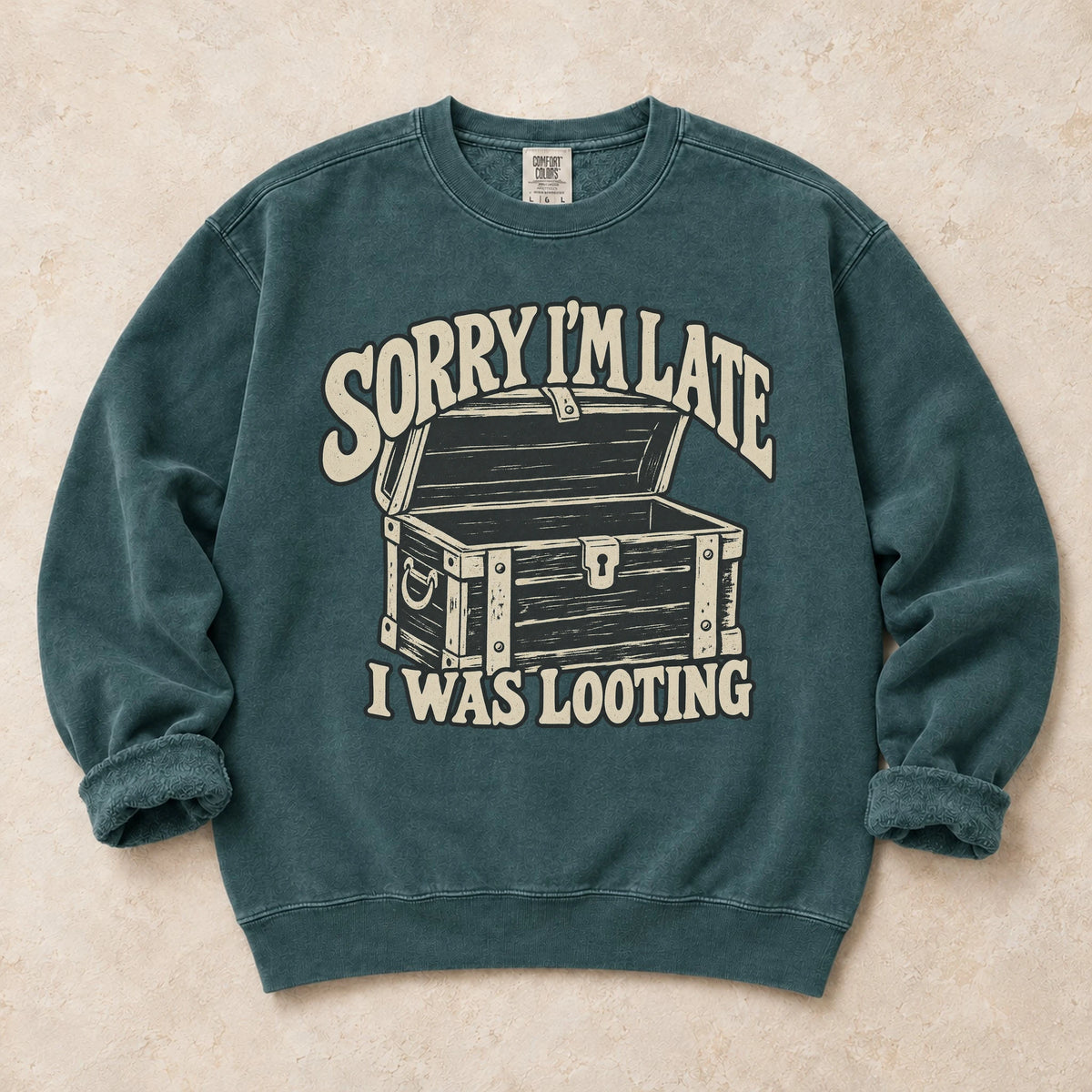 Blue Spruce gaming sweatshirt. A treasure chest explains the apology, sorry I'm late, I was looting.