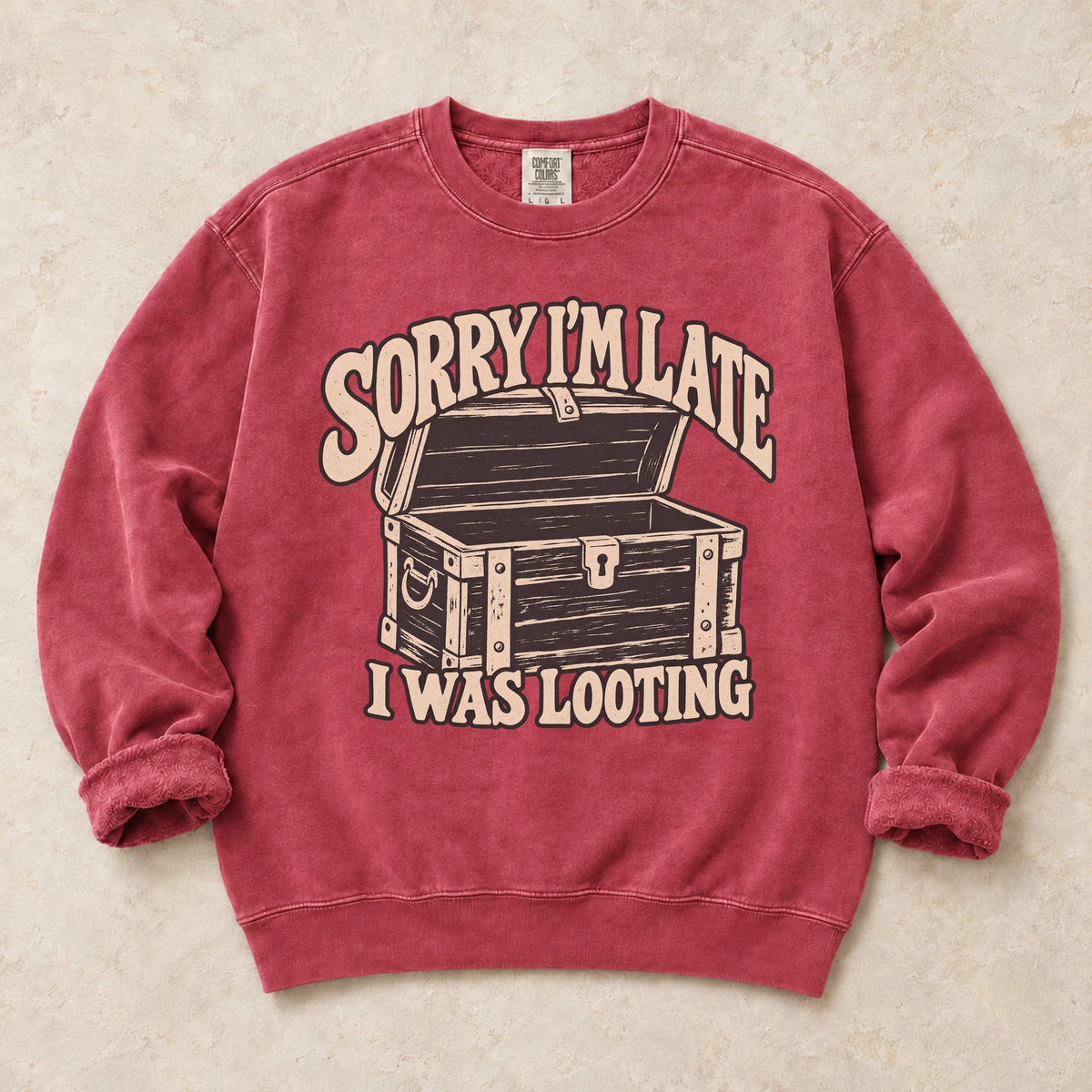 Crimson gaming sweatshirt. A treasure chest explains the apology, sorry I'm late, I was looting.