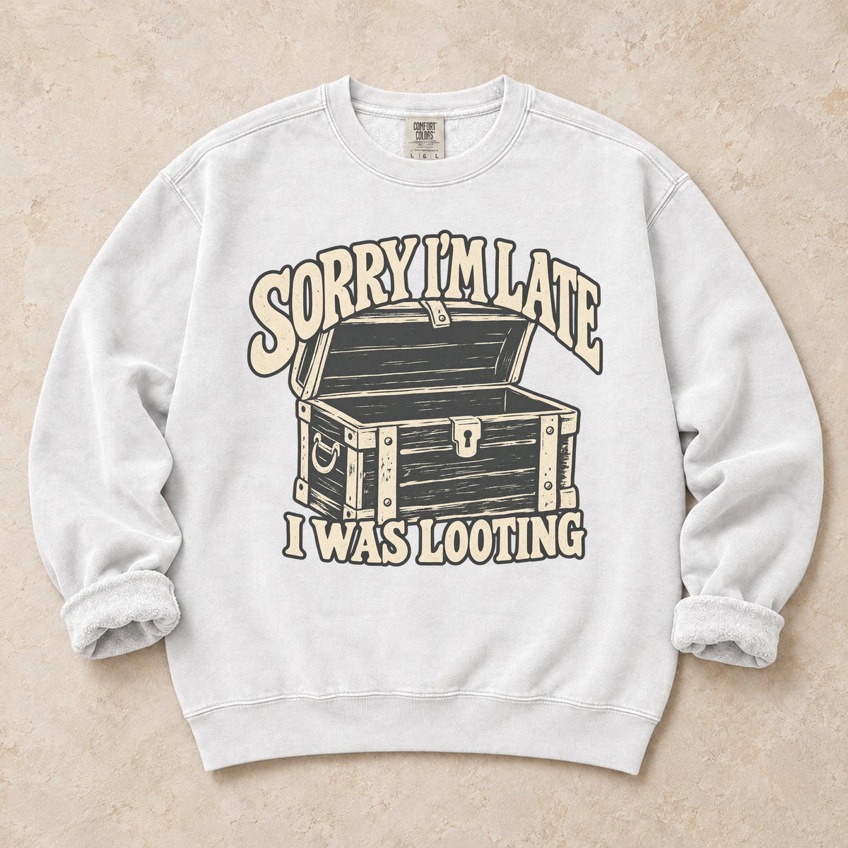 White gaming sweatshirt. A treasure chest explains the apology, sorry I'm late, I was looting.