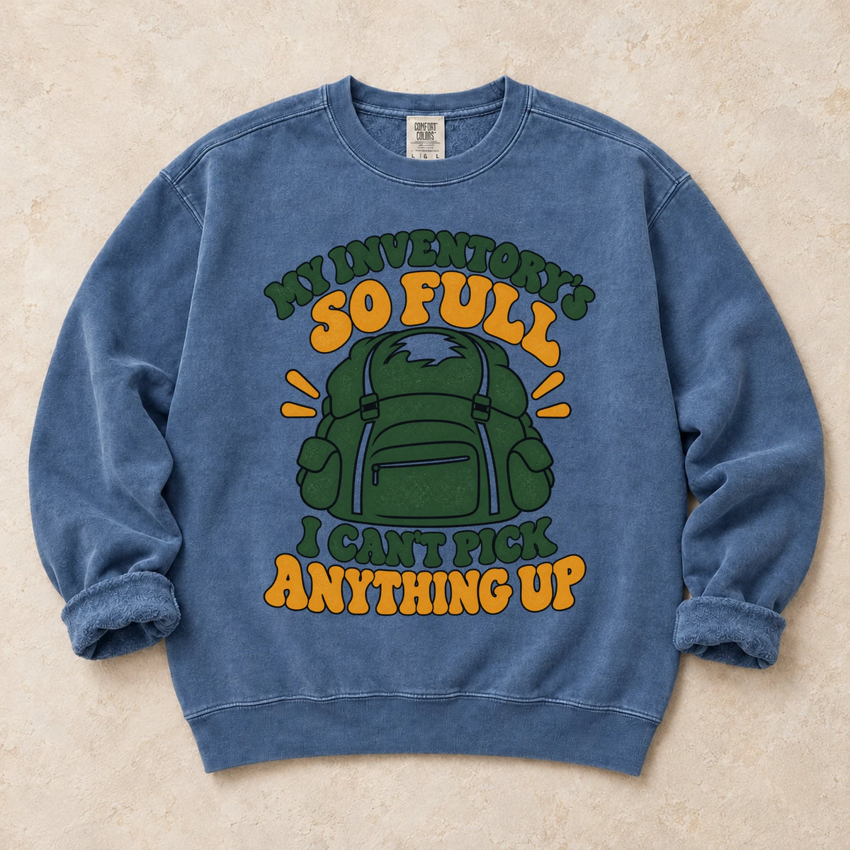 Blue Jean gaming sweatshirt. A stuffed backpack admits the inventory is too full to pick anything up.
