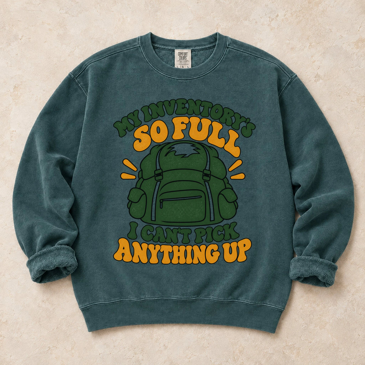 Blue Spruce gaming sweatshirt. A stuffed backpack admits the inventory is too full to pick anything up.