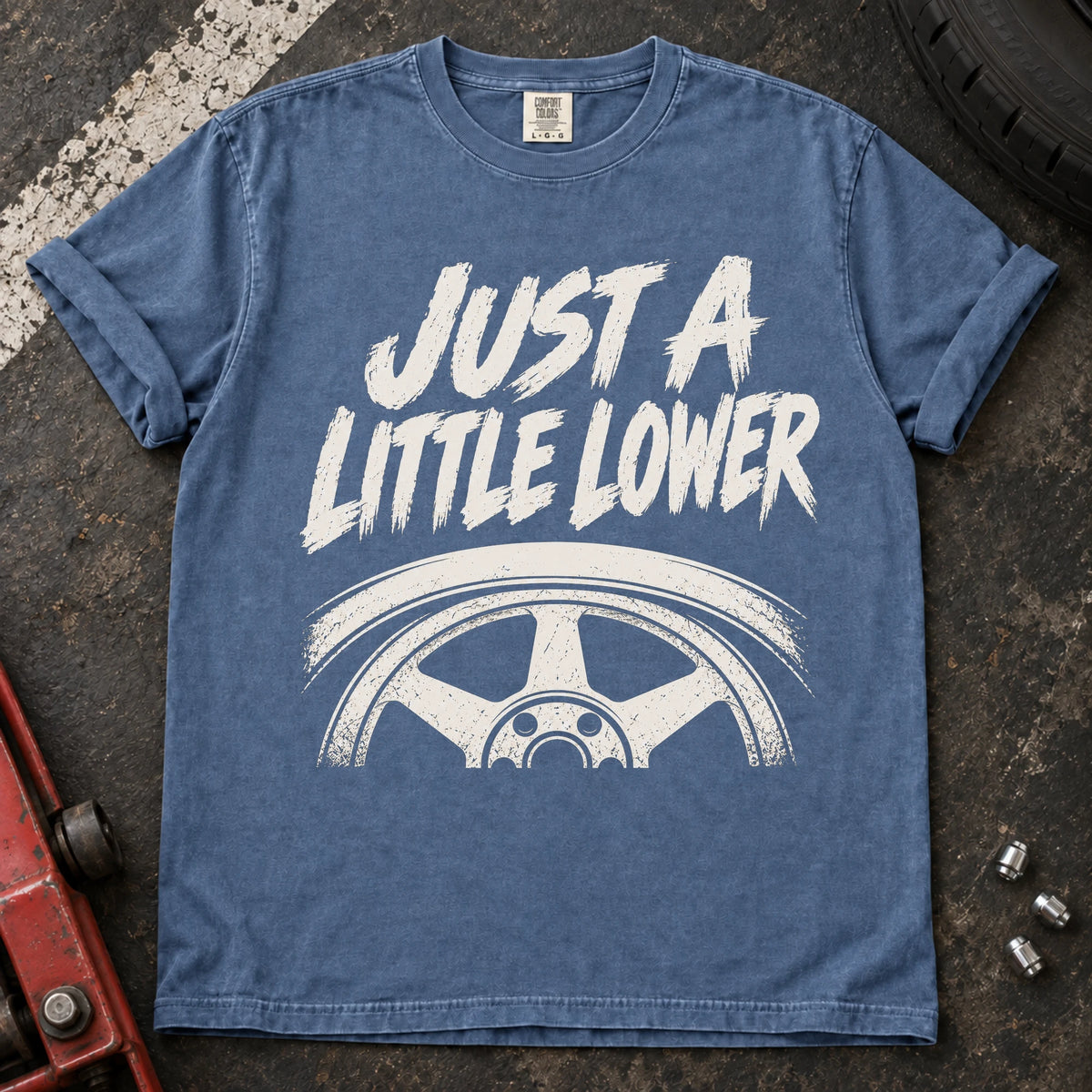 Blue Jean car enthusiast T-shirt. A wheel tucked under a fender accompanies just a little lower.