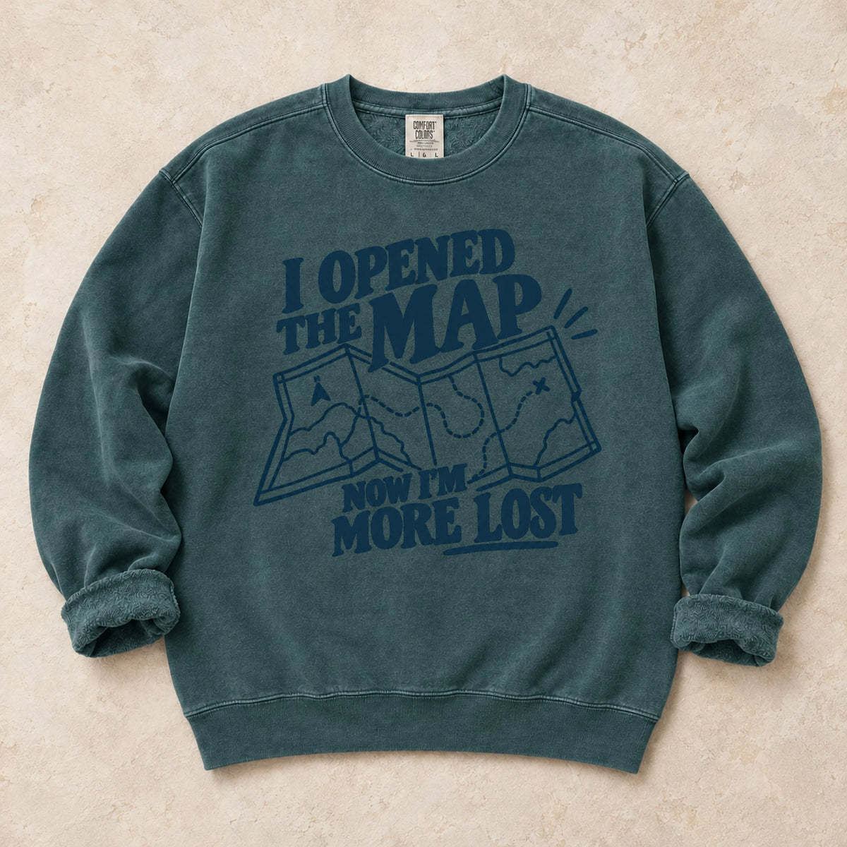 Blue Spruce gaming sweatshirt. An unfolded map explains why opening the map made the player more lost.