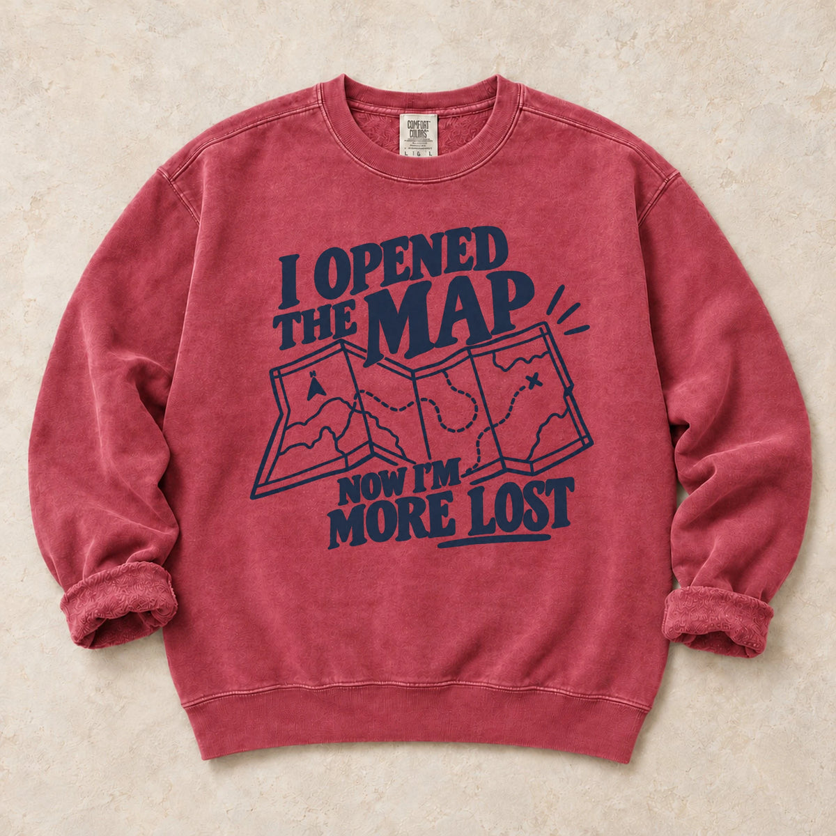 Crimson gaming sweatshirt. An unfolded map explains why opening the map made the player more lost.