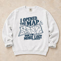 White gaming sweatshirt. An unfolded map explains why opening the map made the player more lost.
