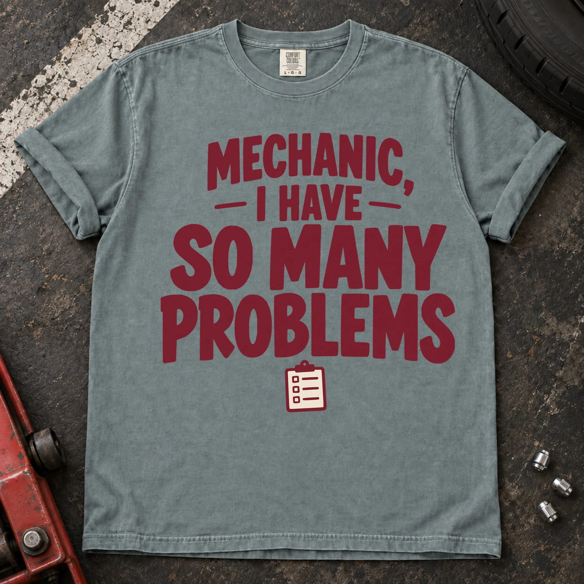 Bay T-shirt with burgundy lettering reading 'Mechanic, I have so many problems' and a small checklist.