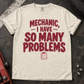 Ivory T-shirt with burgundy lettering reading 'Mechanic, I have so many problems' and a small checklist.