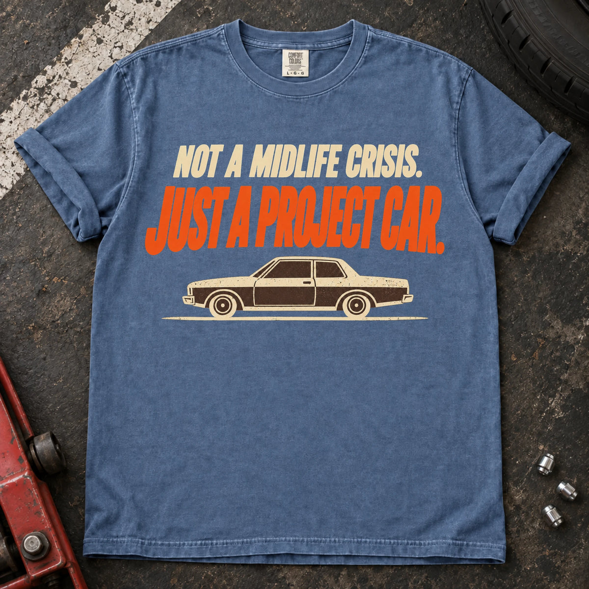 Blue Jean car enthusiast T-shirt. An older sedan explains not a midlife crisis, just a project car.