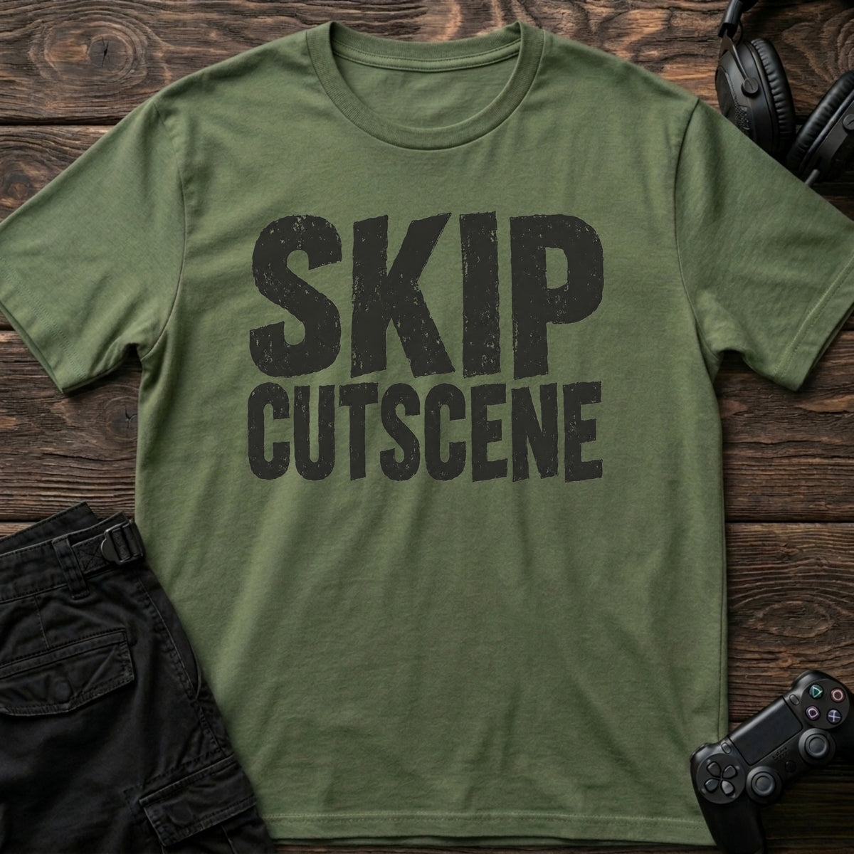 Military Green gaming T-shirt. Skip cutscene, in worn bold lettering for impatient gamers.