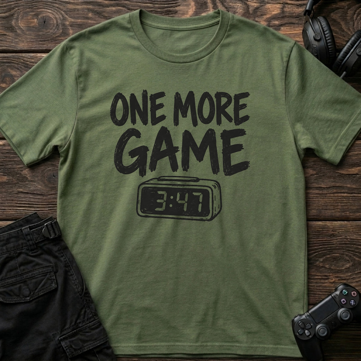 Military Green gaming T-shirt. A digital clock nearing four accompanies the promise of one more game.