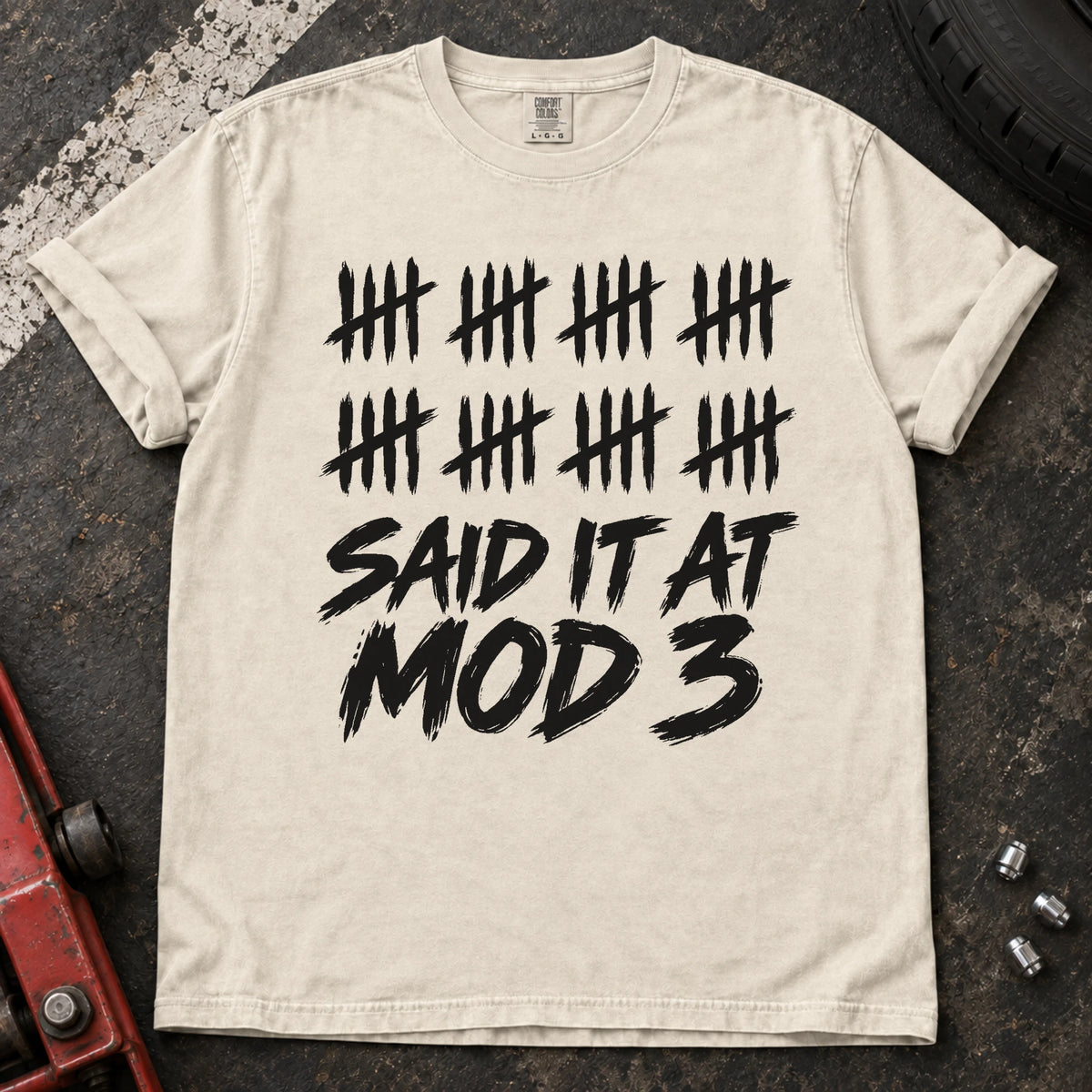Ivory car enthusiast T-shirt. A long row of tally marks proves done-modifying was said at mod three.