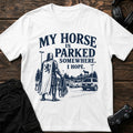 White gaming T-shirt. An armored knight searches a modern parking lot for a horse, hopefully.