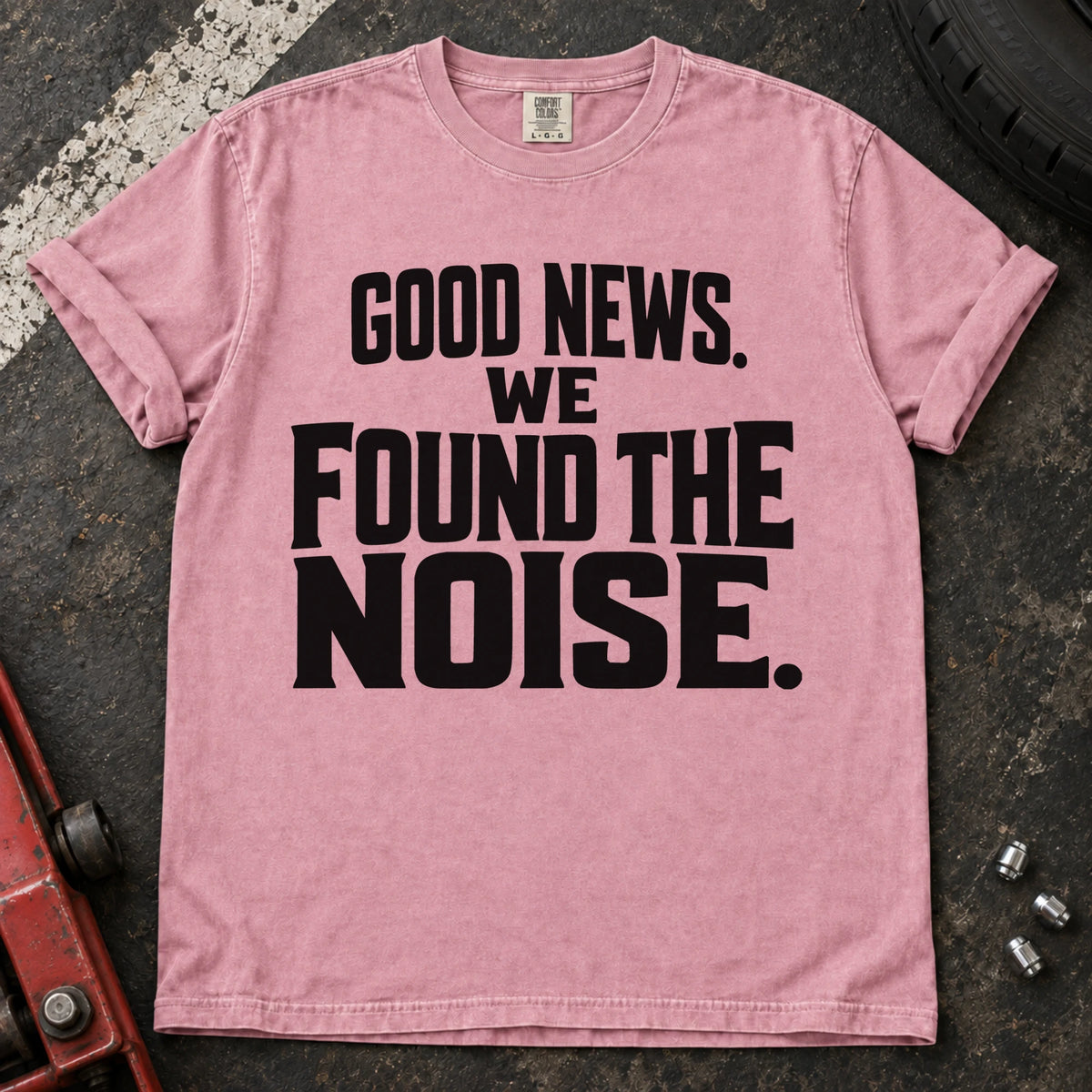Blossom T-shirt with bold stacked lettering reading 'Good news. We found the noise'.