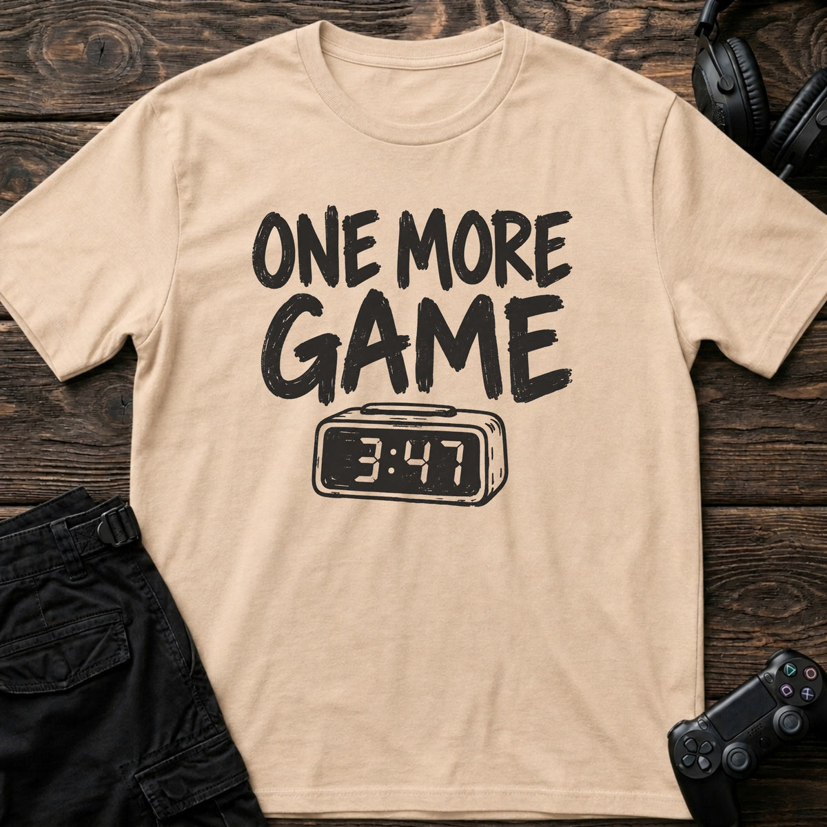 Natural gaming T-shirt. A digital clock nearing four accompanies the promise of one more game.