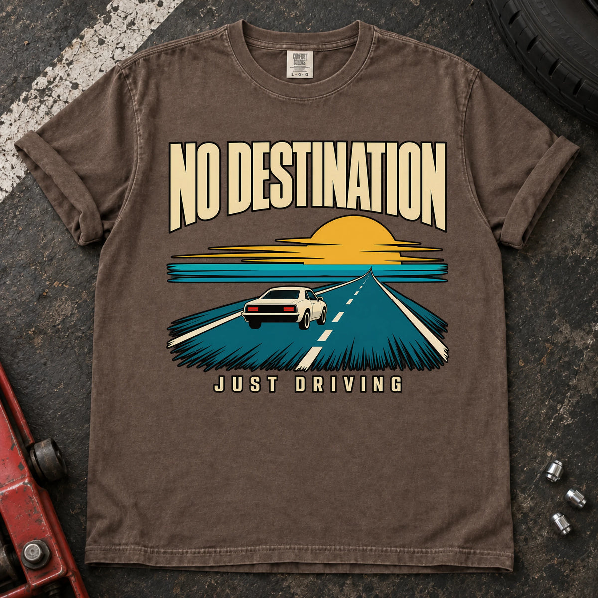 Espresso T-shirt showing a car on a road toward a sunset with 'No destination, just driving'.