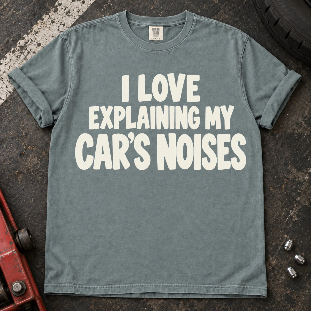 Bay T-shirt with bold lettering reading 'I love explaining my car's noises'.