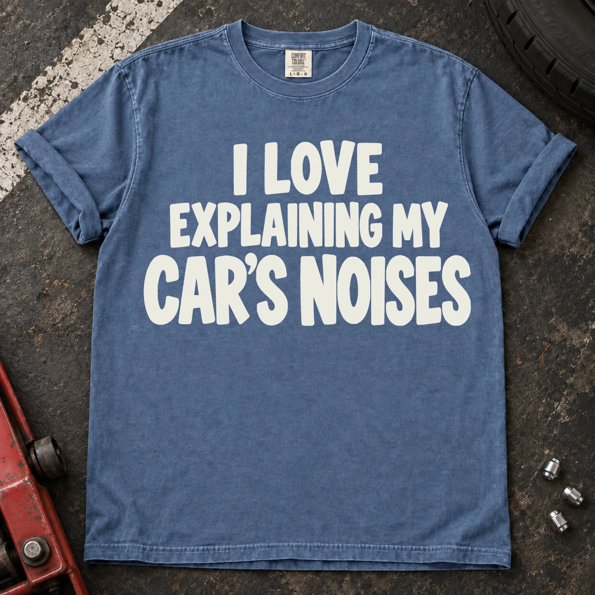 Blue Jean T-shirt with bold lettering reading 'I love explaining my car's noises'.