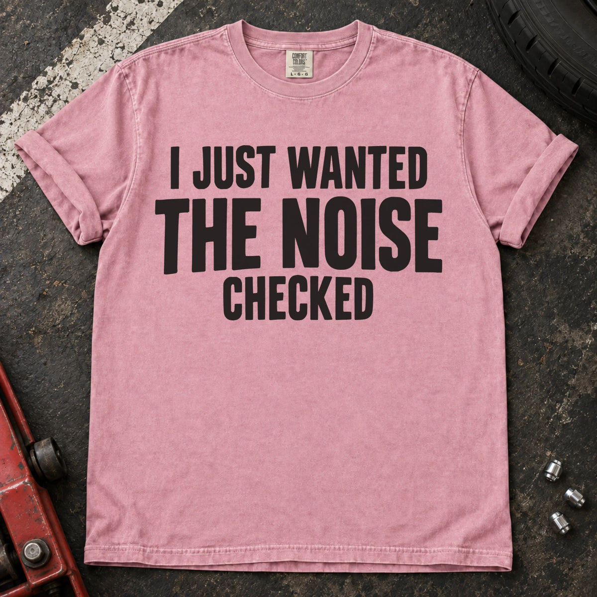 Blossom T-shirt with stacked black lettering reading 'I just wanted the noise checked'.