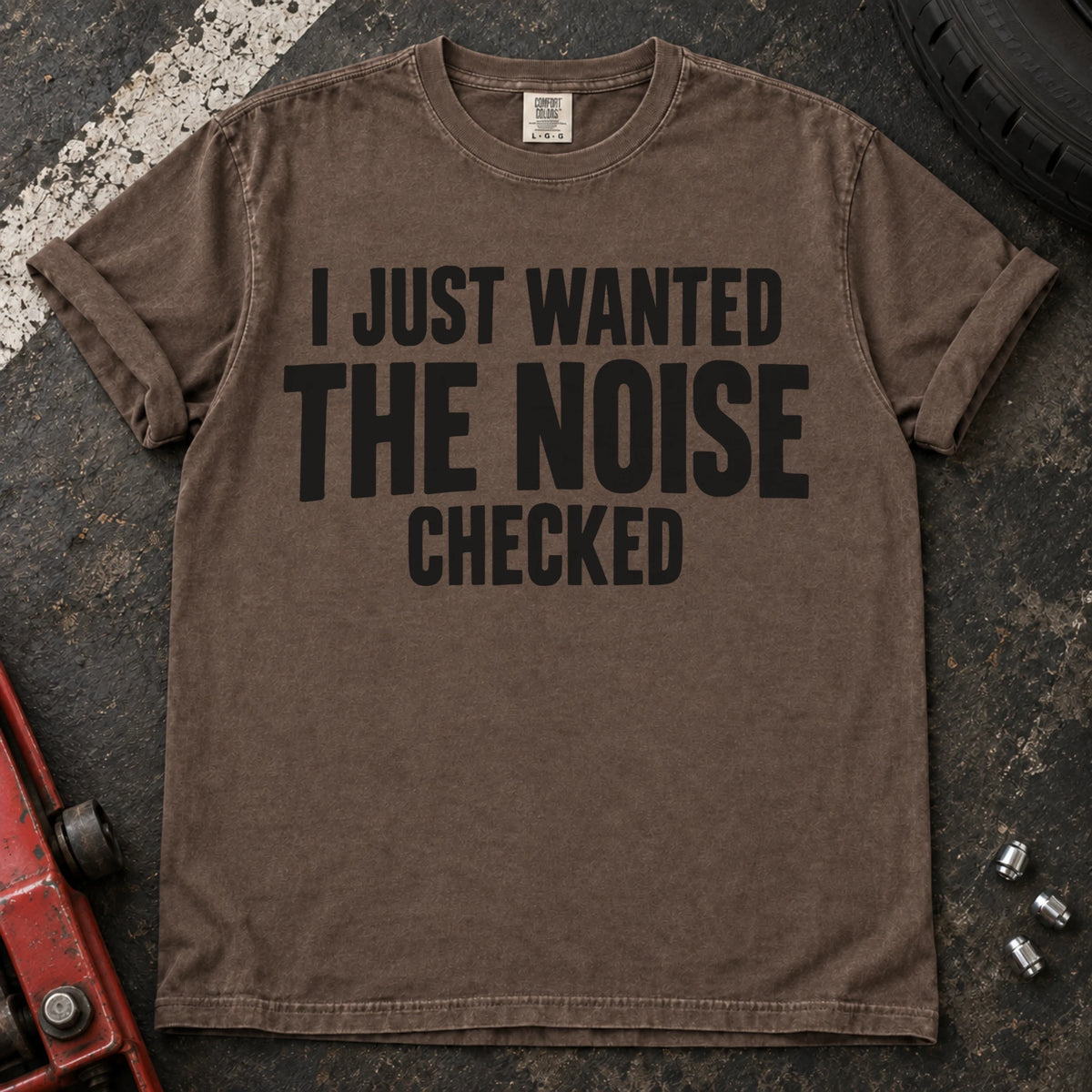 Espresso T-shirt with stacked black lettering reading 'I just wanted the noise checked'.