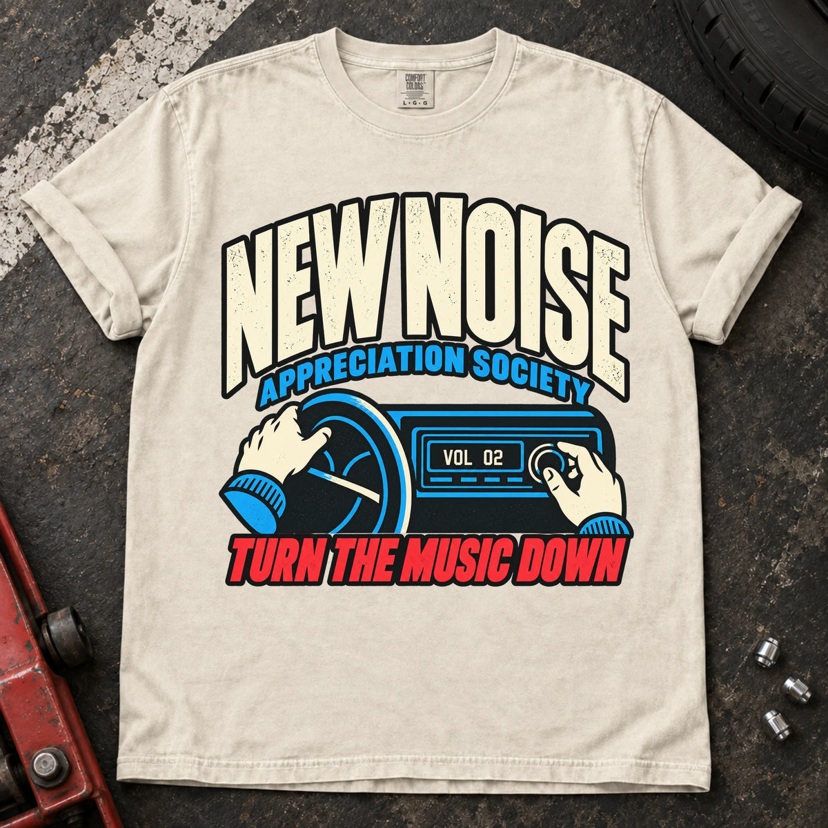 Ivory car enthusiast T-shirt. Hands lower the stereo for the New Noise Appreciation Society.
