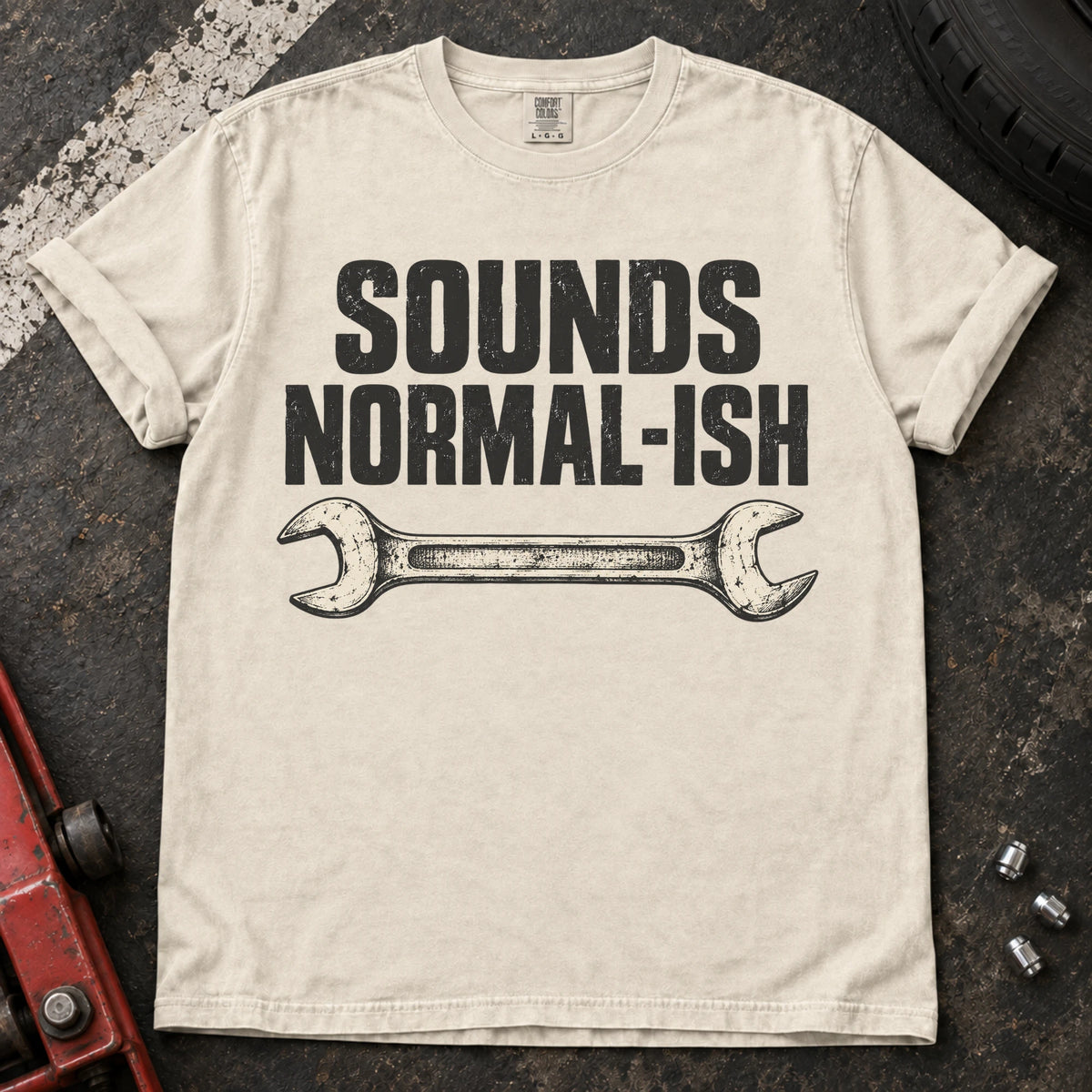 Ivory car enthusiast T-shirt. A worn wrench gives sounds normal-ish a mechanic's cautious reassurance.