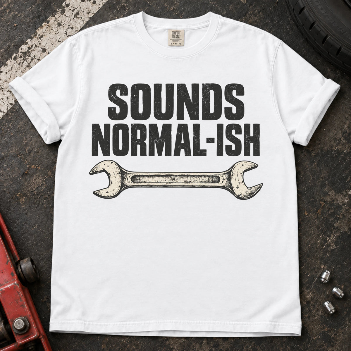 White car enthusiast T-shirt. A worn wrench gives sounds normal-ish a mechanic's cautious reassurance.