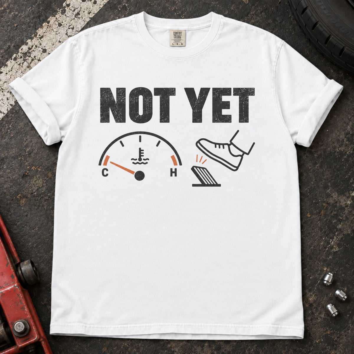 White car enthusiast T-shirt. A temperature gauge tells the impatient right foot, not yet.