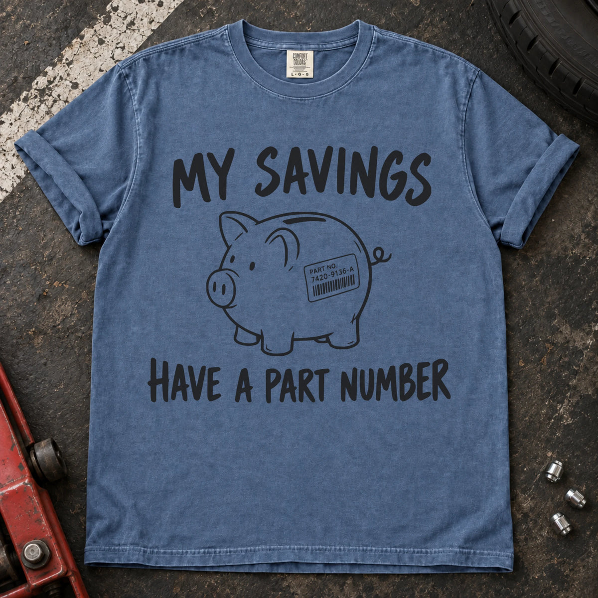Blue Jean T-shirt showing a piggy bank with a parts label beneath 'My savings have a part number'.