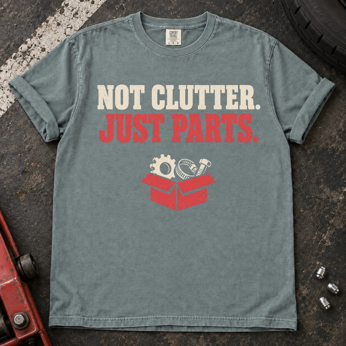 Bay car enthusiast T-shirt. A box of components insists not clutter, just parts.