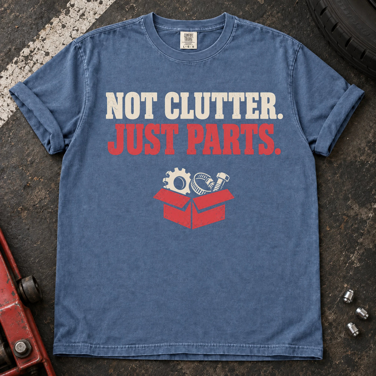 Blue Jean car enthusiast T-shirt. A box of components insists not clutter, just parts.