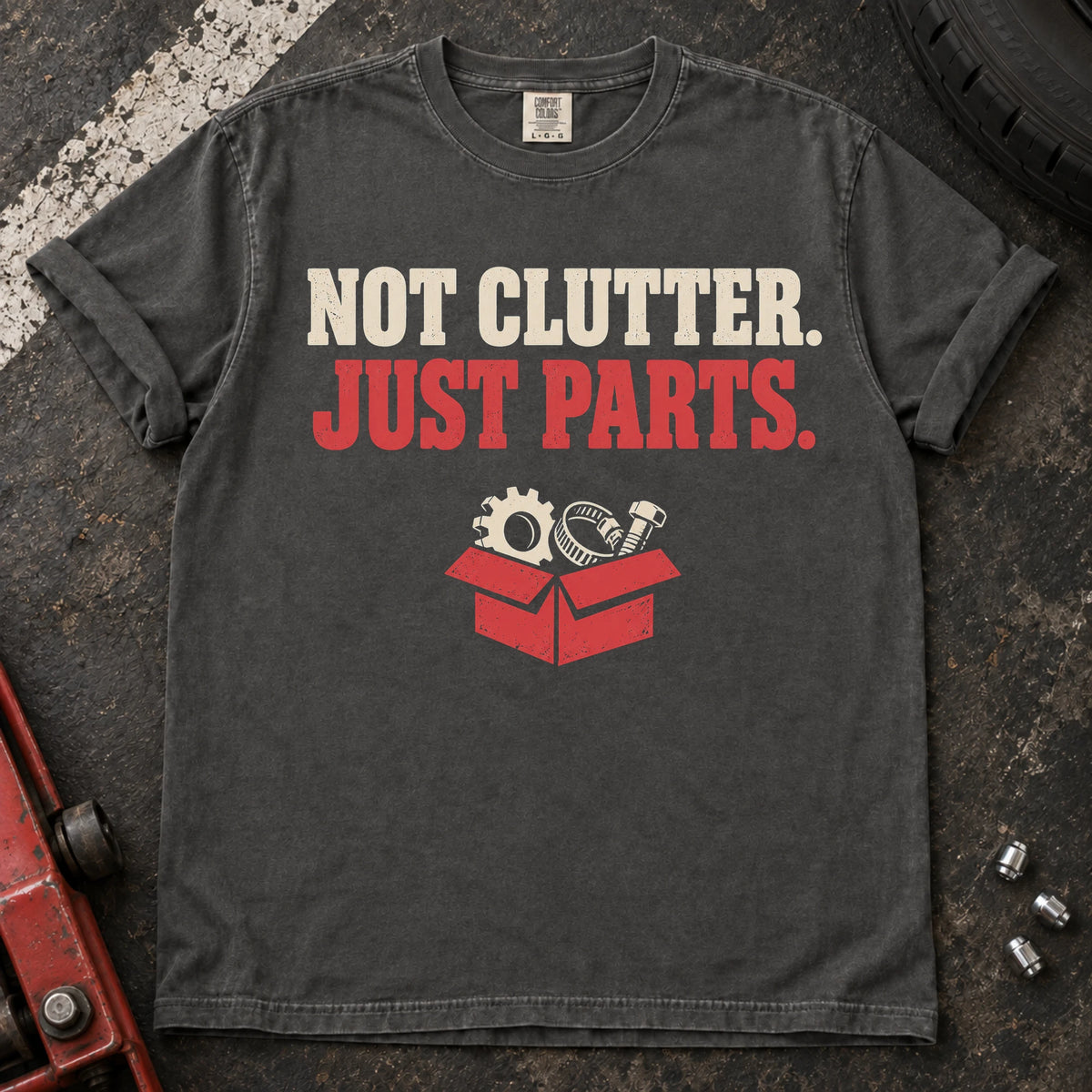 Pepper car enthusiast T-shirt. A box of components insists not clutter, just parts.