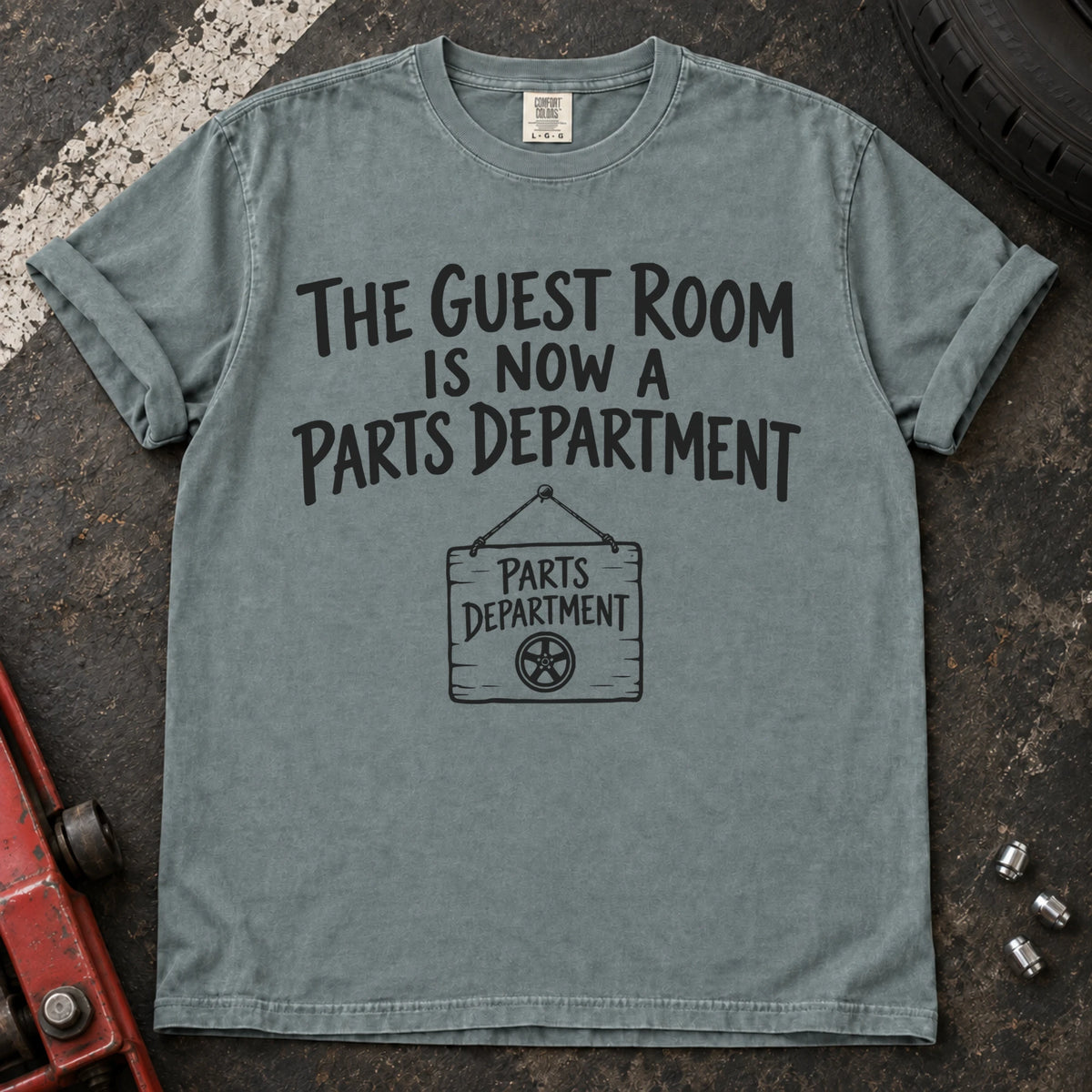 Bay T-shirt showing a Parts Department sign beneath 'The guest room is now a parts department'.