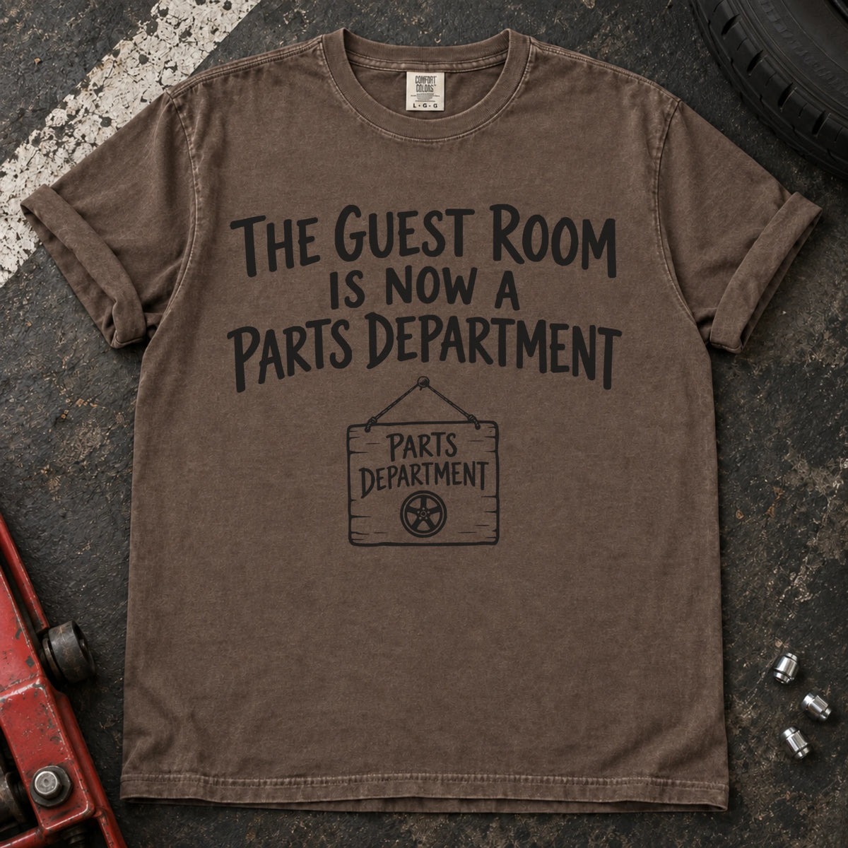 Espresso T-shirt showing a Parts Department sign beneath 'The guest room is now a parts department'.