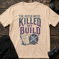 Natural gaming T-shirt. A patch-note scroll and broken shield show an update that killed the build.