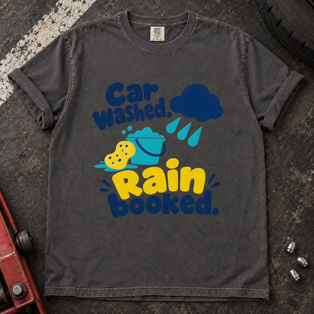 Pepper T-shirt showing a rain cloud, droplets and cleaning sponge with 'Car washed. Rain booked'.