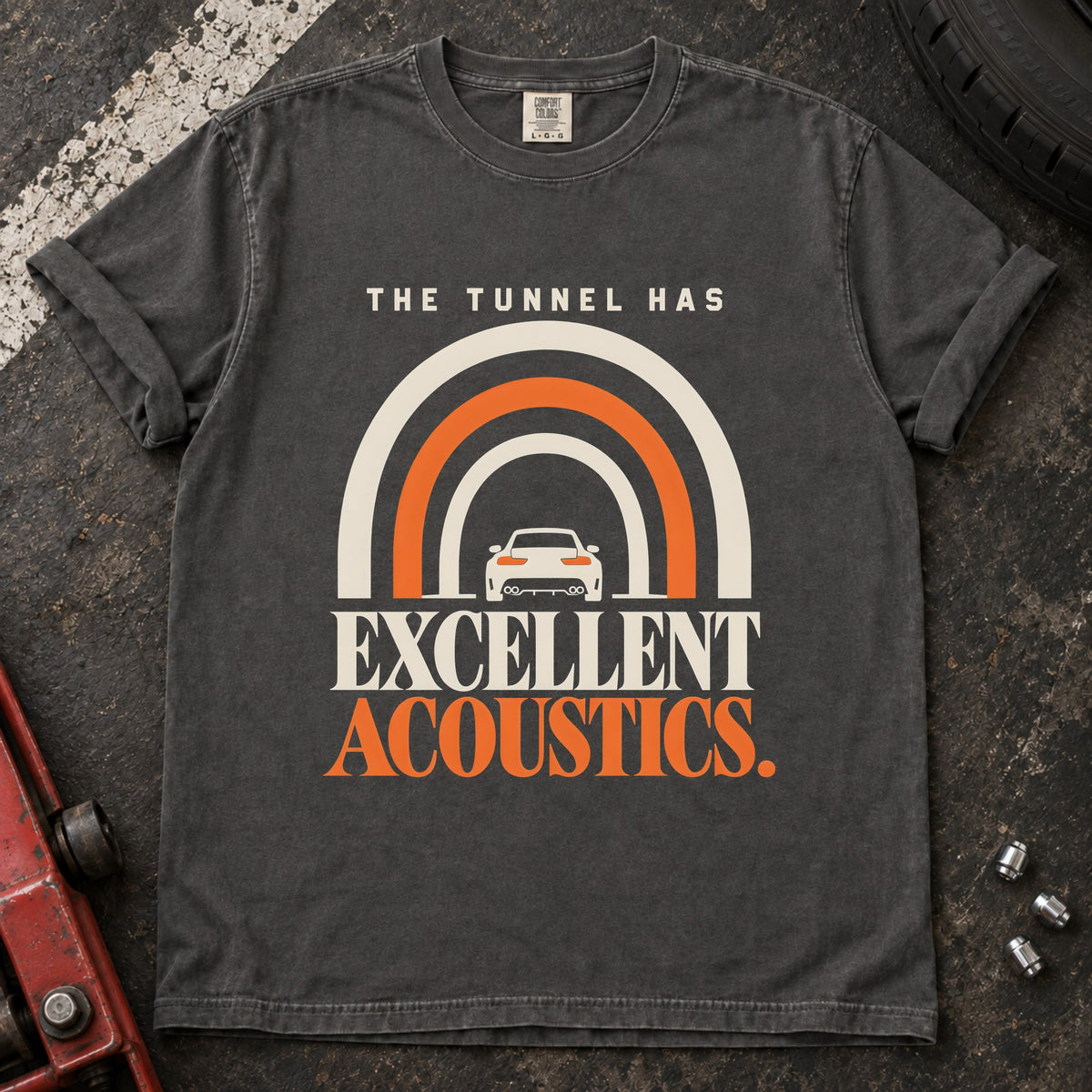 Pepper T-shirt showing a car beneath a tunnel-shaped arch with 'The tunnel has excellent acoustics'.