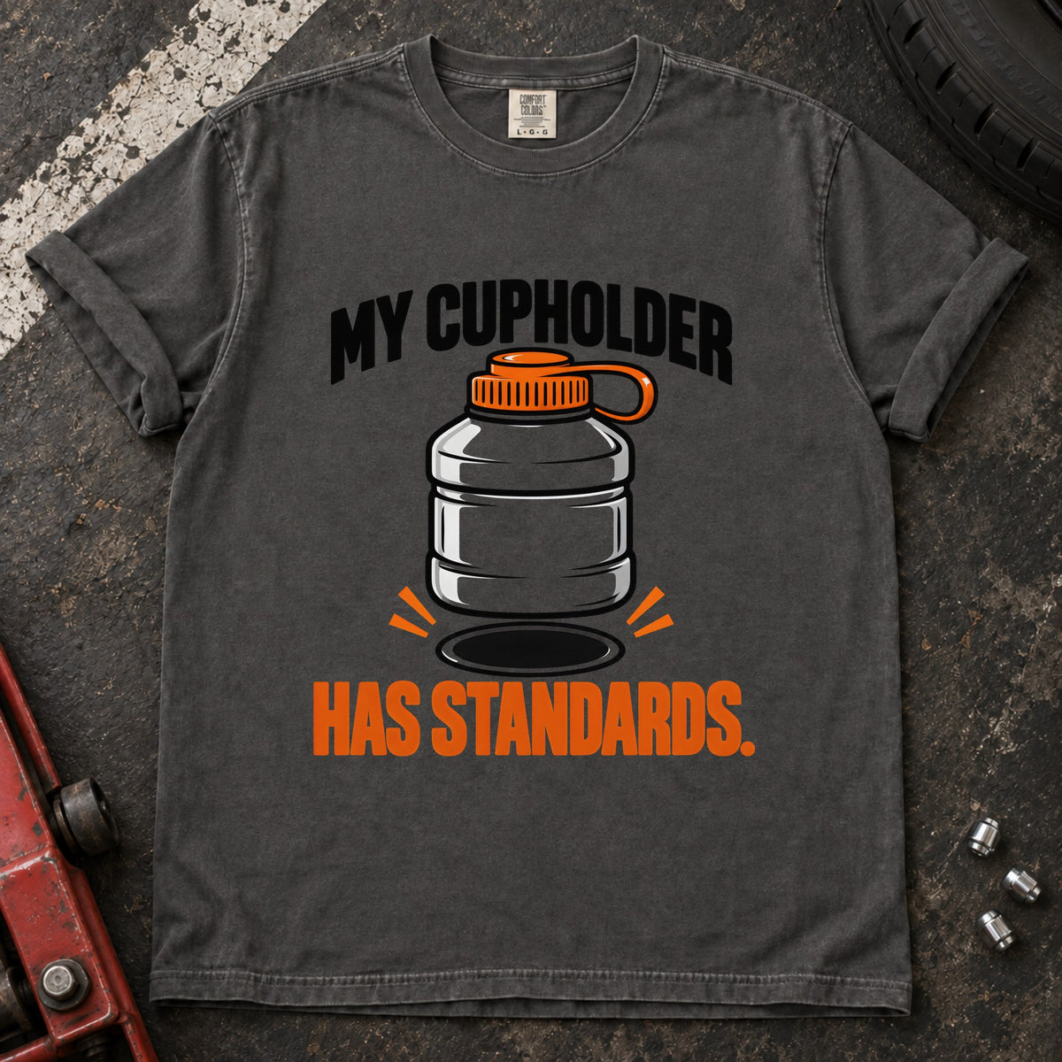 Pepper T-shirt showing an oversized bottle and cupholder with 'My cupholder has standards'.